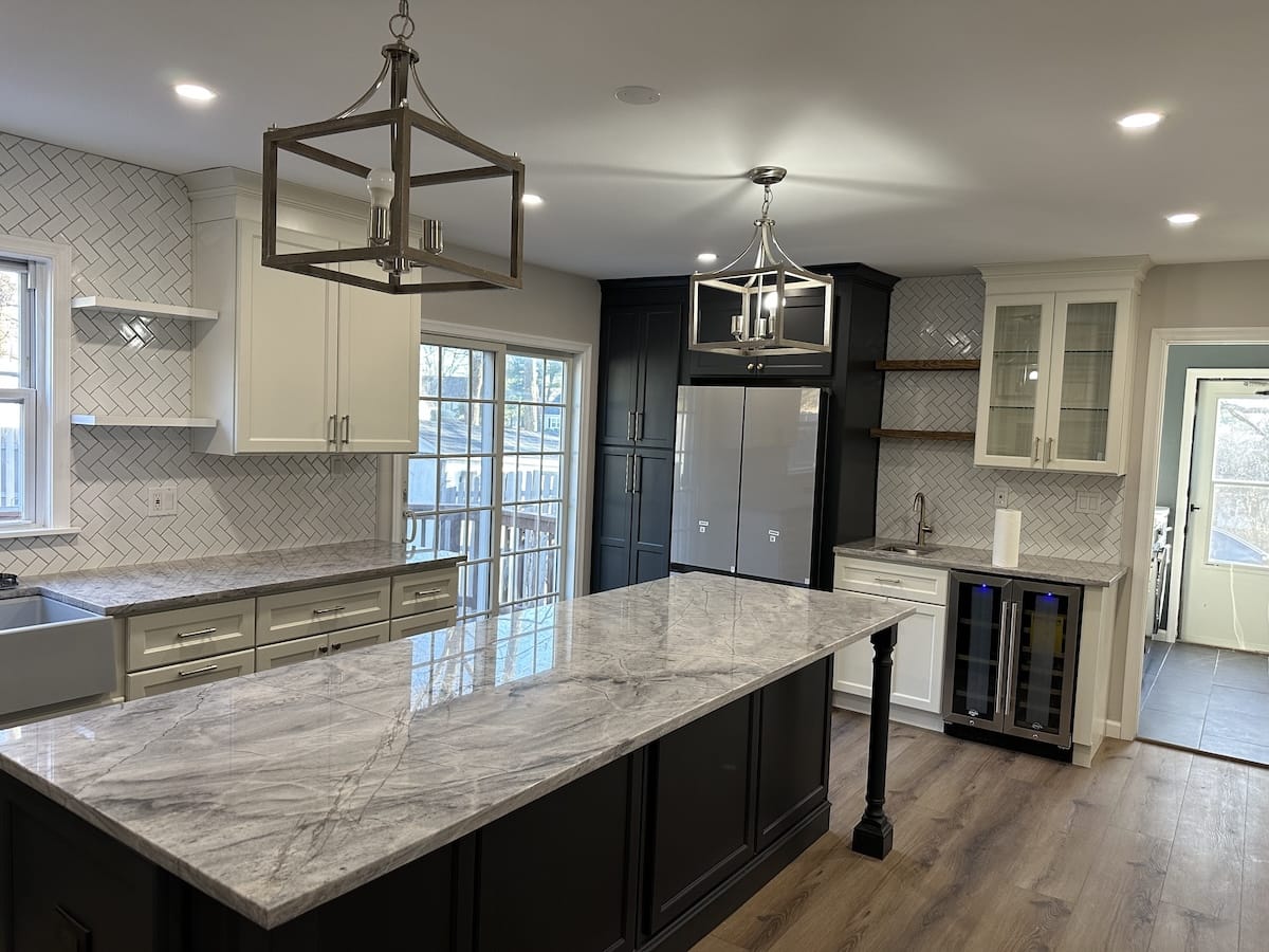 Kitchen remodel with white cabinets and a bright window